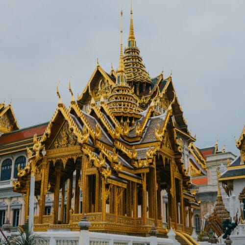 Glimpse the ornate architecture and golden elegance of Bangkok's Grand Palace.